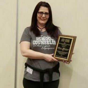  Photo of Laura Malmstrom holding plague